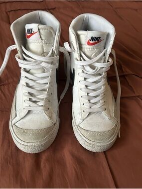 Nike White High-Top Sneakers with Red Swoosh Accent